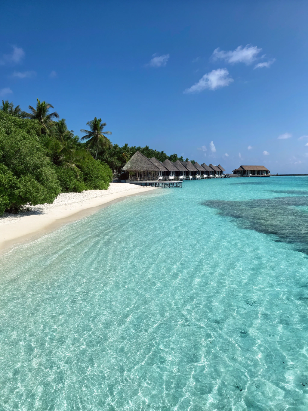 Maldives private overwater bungalows on crystal lagoon