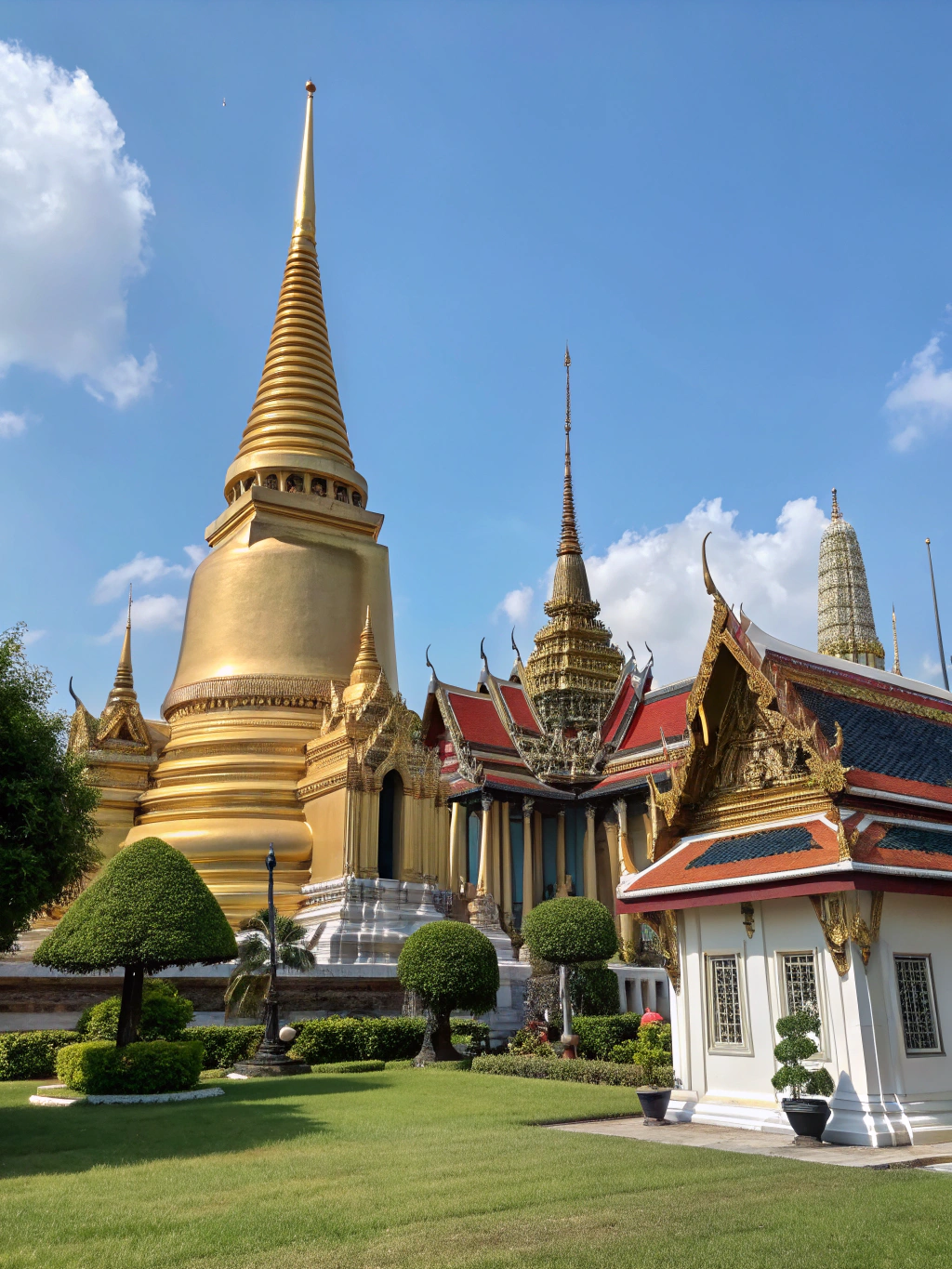 Bangkok Grand Palace spire under clear blue skies