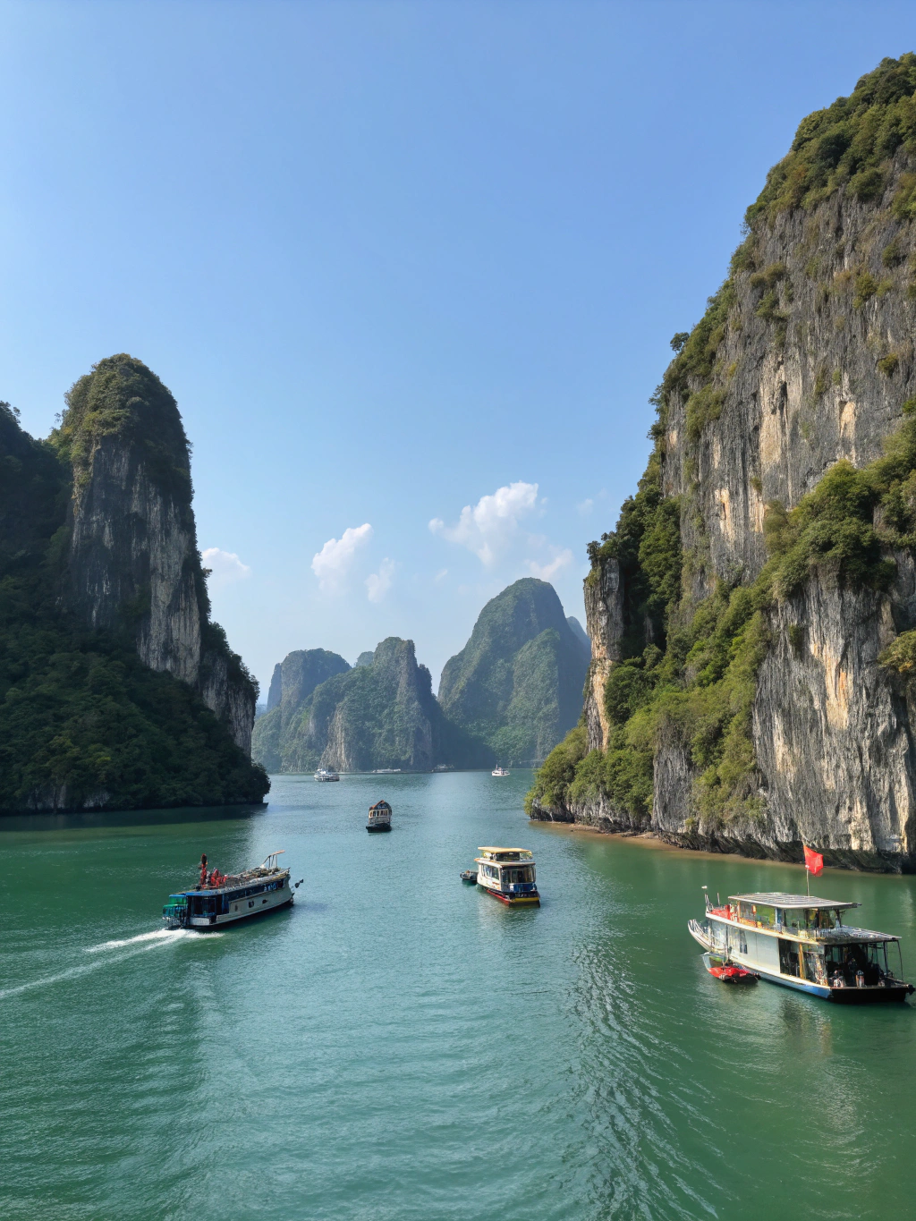 Ha Long Bay emerald waters and limestone karsts