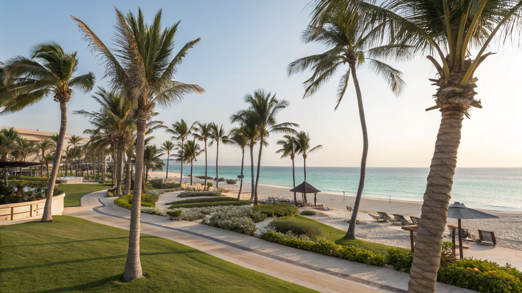 Luxury tropical beach resort with oceanfront sunbeds arranged by Travizi
